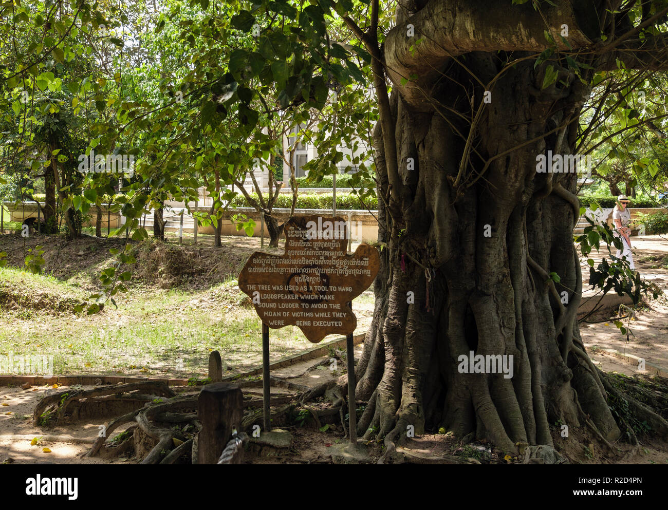 Sign by Magic Tree where loudspeakers drowned the sounds of dying victims in The Killing Fields Genocidal Centre. Choeung Ek, Phnom Penh, Cambodia Stock Photo
