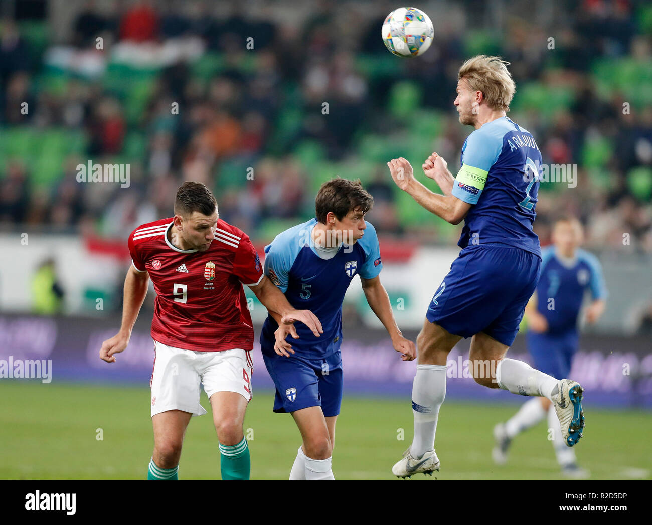 BUDAPEST, HUNGARY - NOVEMBER 18: (r-l) Paulus Arajuuri of Finland heads the ball in front of Sauli Vaisanen of Finland and Adam Szalai of Hungary during the UEFA Nations League group stage match between Hungary and Finland at Groupama Arena on November 18, 2018 in Budapest, Hungary. Stock Photo