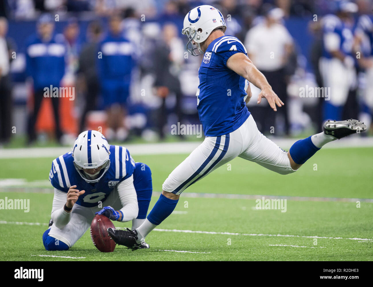 Indianapolis, Indiana, USA. 18th Nov, 2018. Indianapolis Colts placekicker Adam Vinatieri (4) kicks field goal out of the hold by Indianapolis Colts punter Rigoberto Sanchez (2) during NFL football game action between the Tennessee Titans and the Indianapolis Colts at Lucas Oil Stadium in Indianapolis, Indiana. Indianapolis defeated Tennessee 38-10. John Mersits/CSM/Alamy Live News Stock Photo