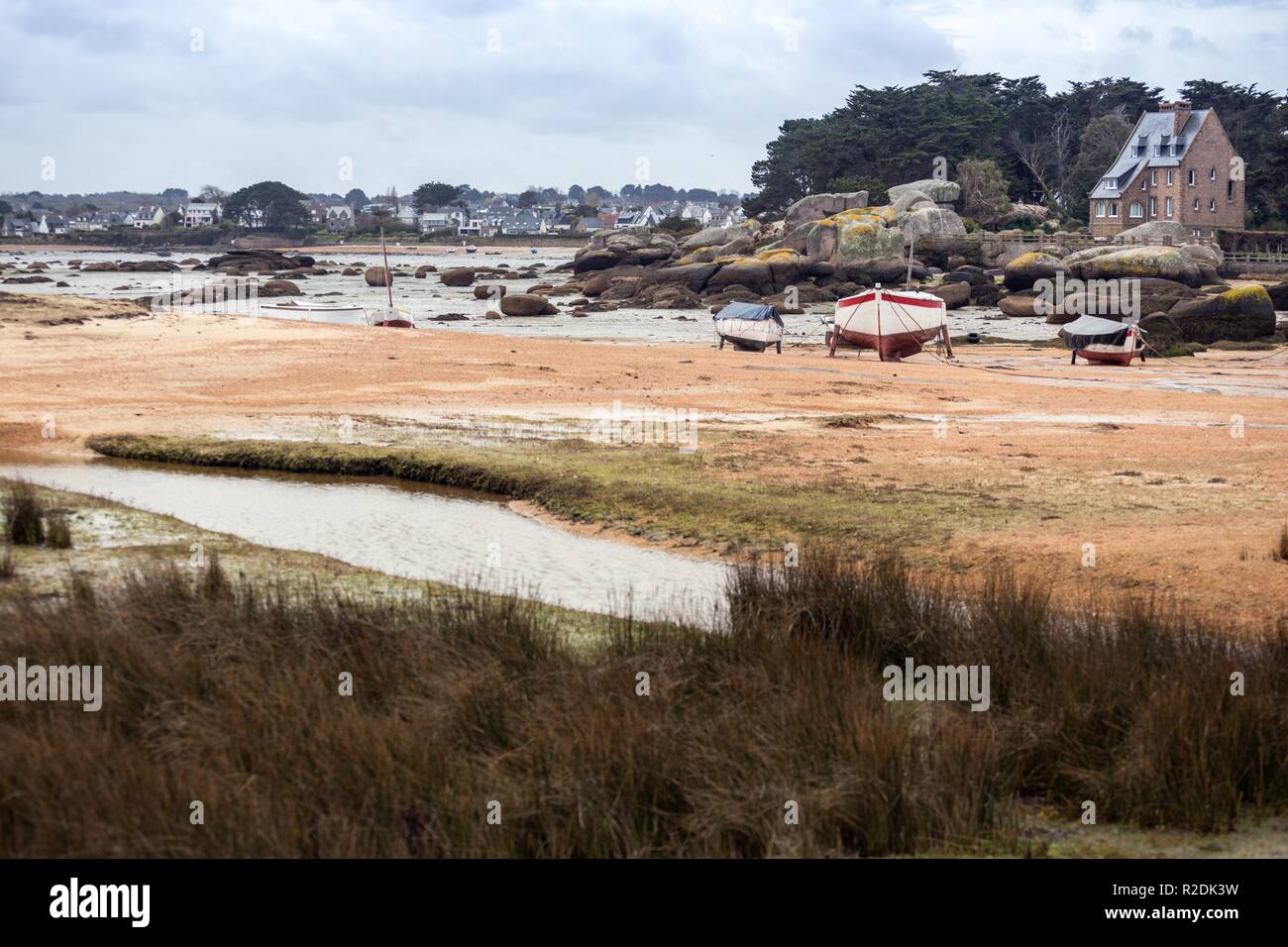 Tregastel. boats at low tide on the coast of Brittany, France Stock ...