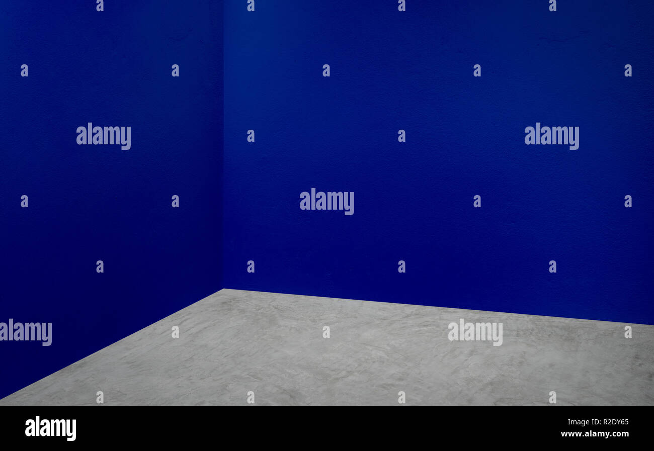 Empty corner navy blue wall and grey concrete floor perspective room,Modern style room,Mock up for display of product,business presentation Stock Photo