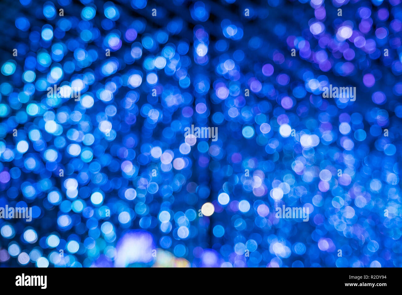 Abstract blue bokeh merge with purple bokeh light background Stock Photo