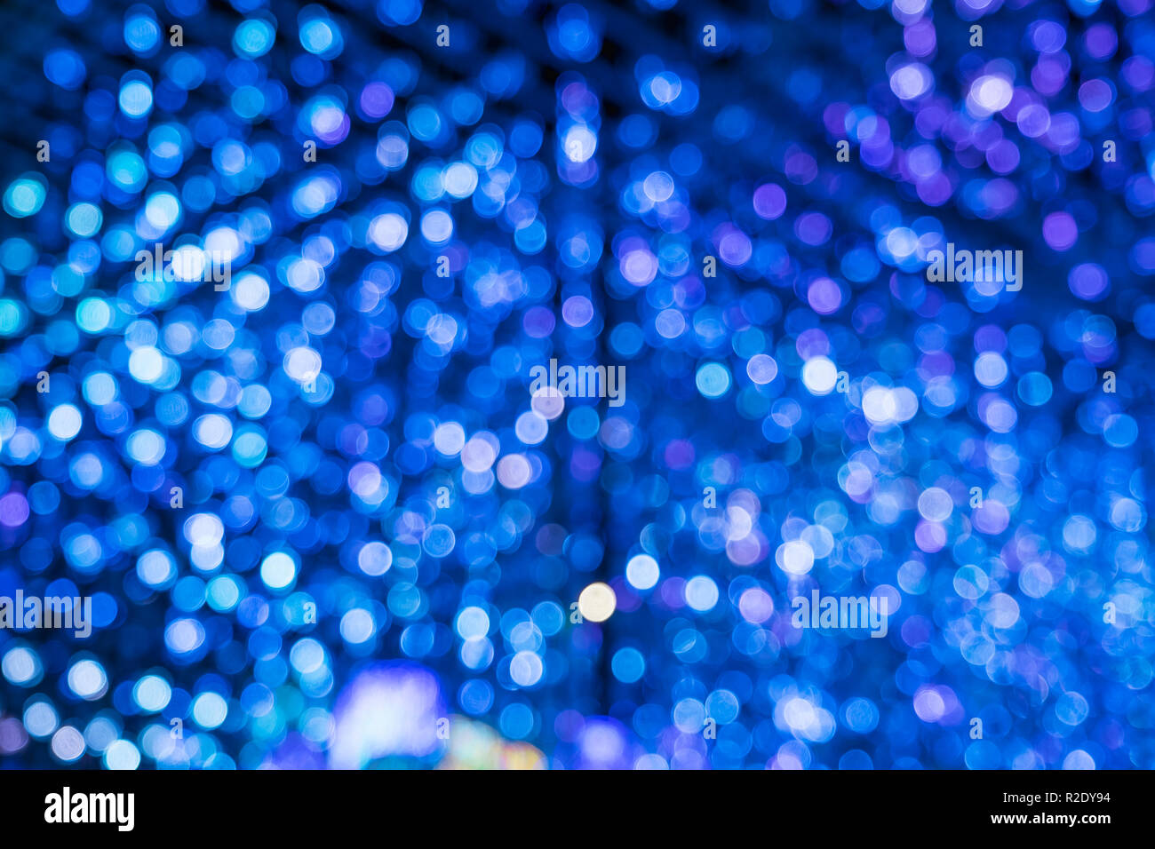 Abstract blue bokeh merge with purple bokeh light background Stock