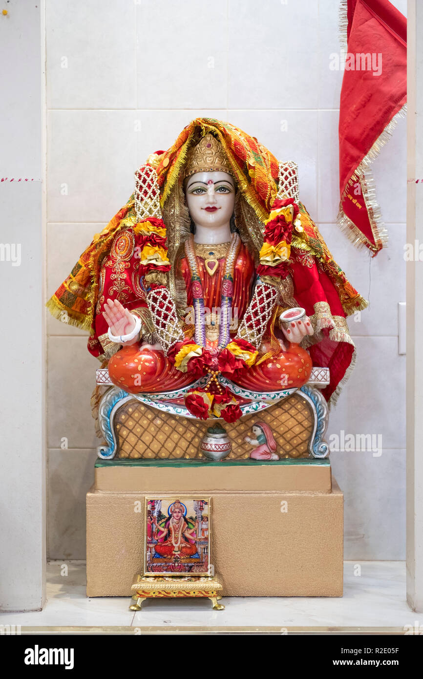 Ornate statue of the Hindu goddess Santoshi. At the Om Shakti Hindu temple in Flushing, Queens, New York. Stock Photo