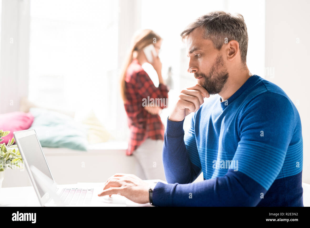 Focused manager analyzing online information Stock Photo