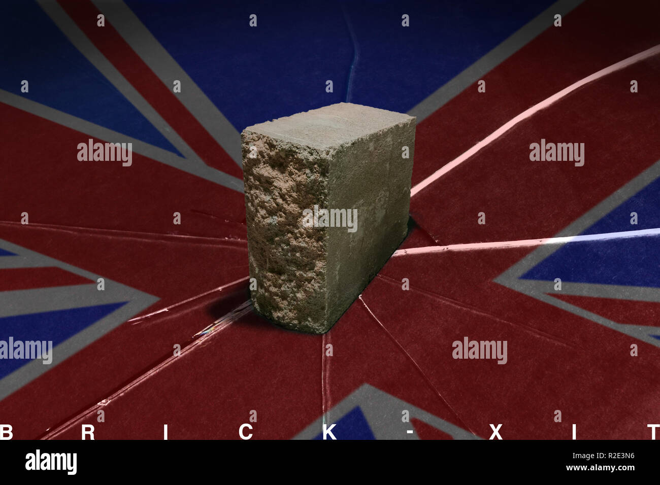 A big brick has to break the image of the British flag. I marked at the bottom of the image: BRICK-XIT Stock Photo