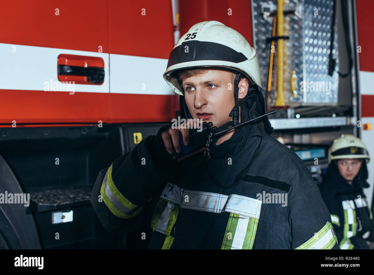 Selective Focus Of Firefighter With Water Hose Free Stock Photo