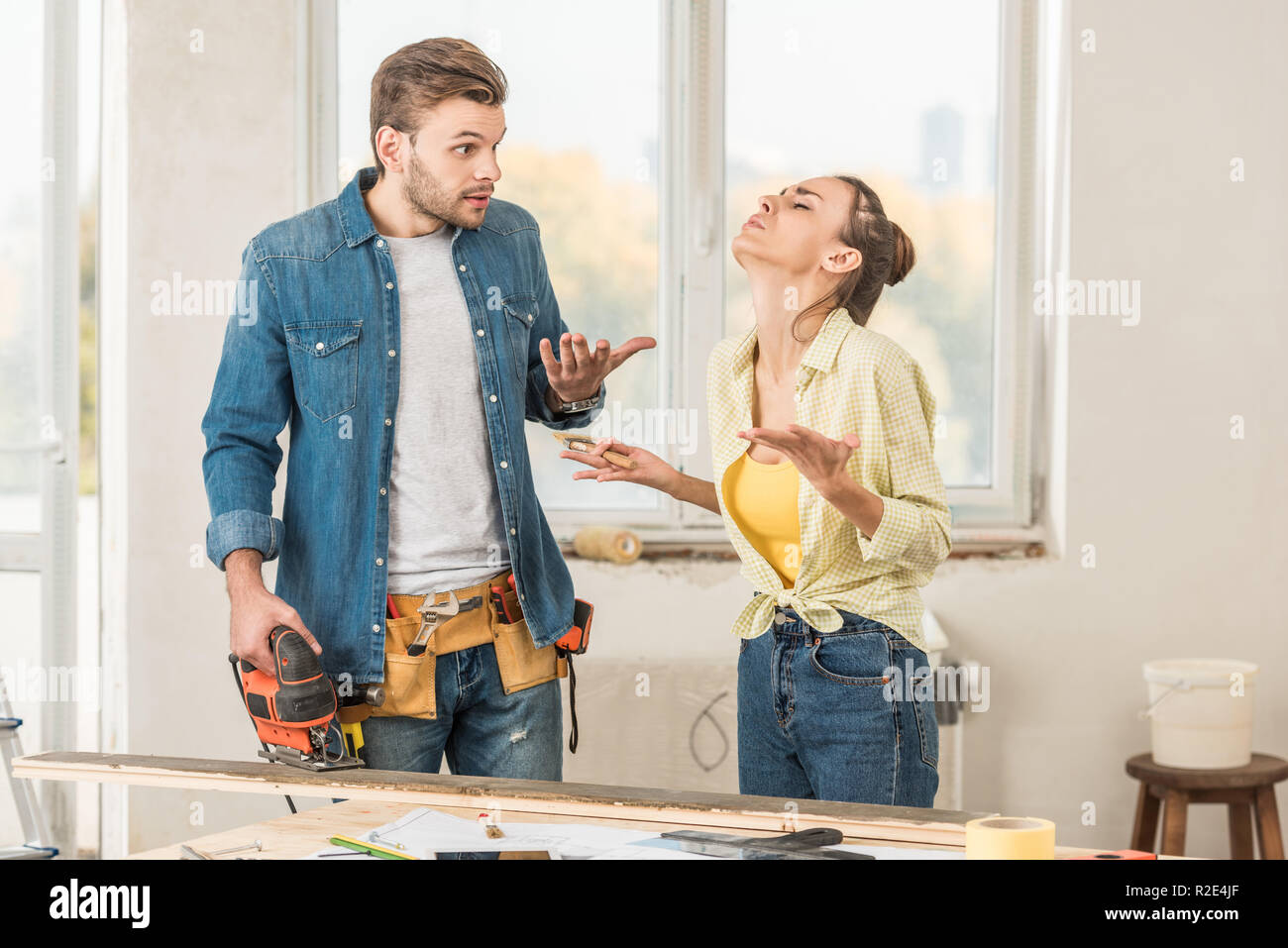 emotional young couple quarreling during home improvement Stock Photo