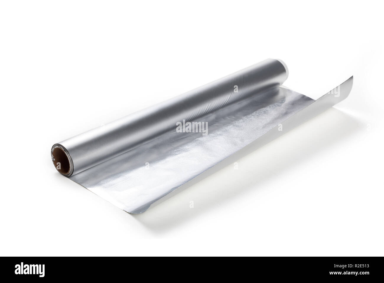 Aluminum foil roll on the white background, close up. Stock Photo