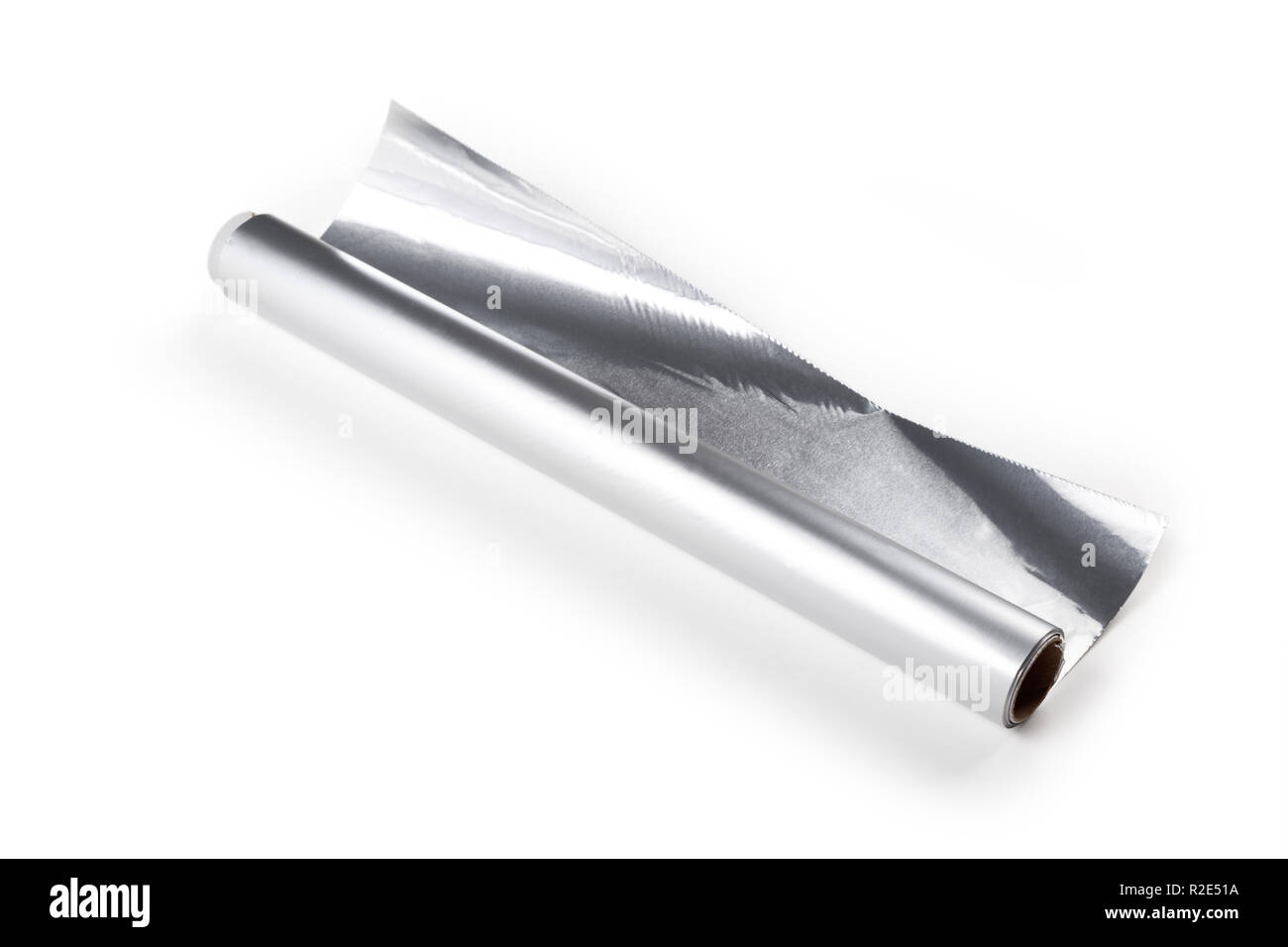 Aluminum foil roll on the white background, close up. Stock Photo