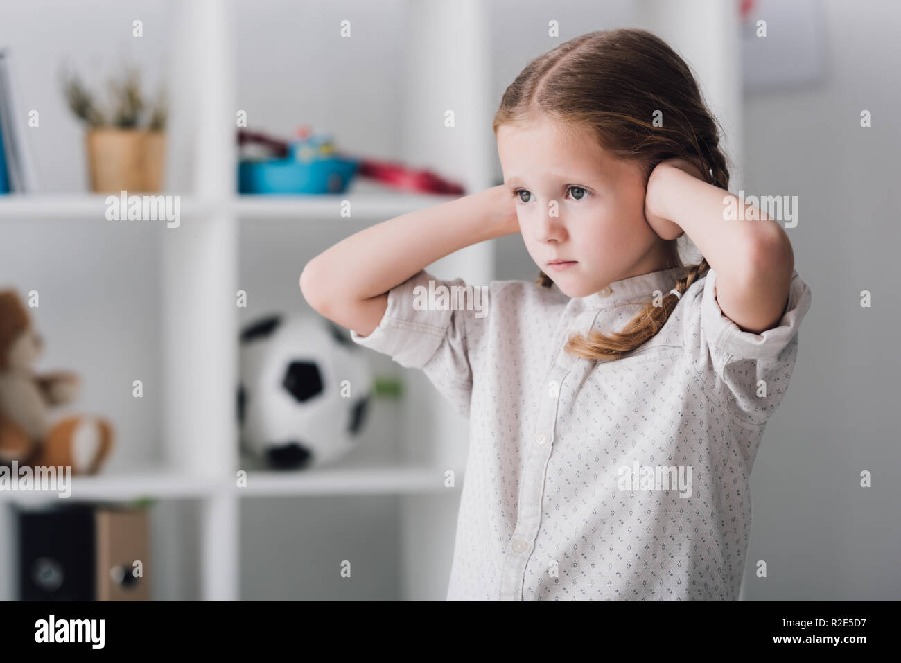 Child covering ears hires stock photography and images Alamy