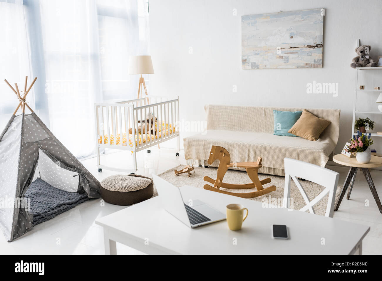 modern interior design of nursery room with baby wigwam and crib Stock Photo