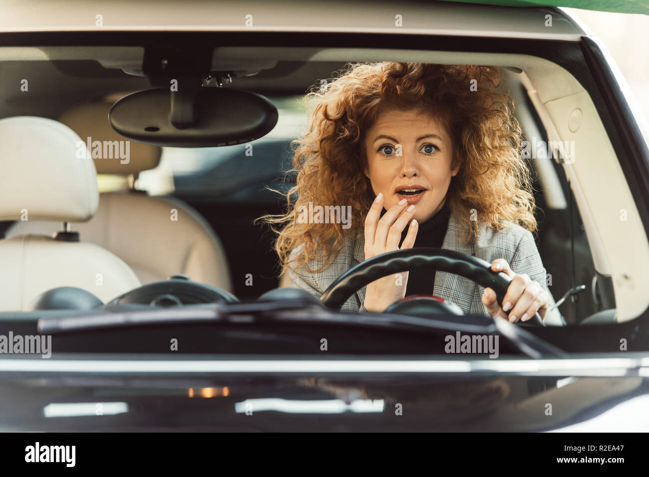 Sitting at steering wheel hi-res stock photography and images - Alamy