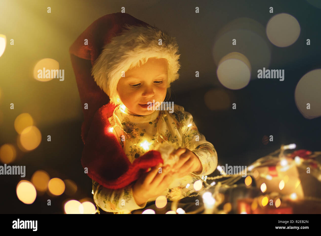 Baby girl opening Christmas presents Stock Photo