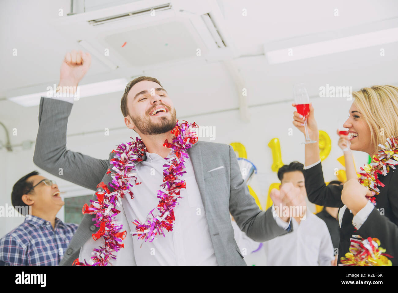caucasian boss businessman dance in office party new year fun celebration. Stock Photo