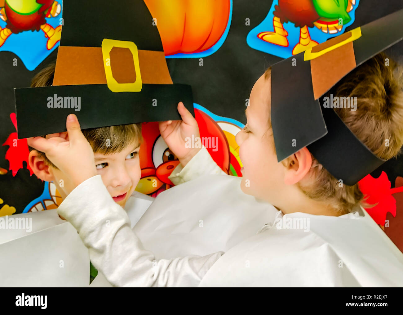 A pre-school boy straightens a friend’s Thanksgiving Pilgrim's hat, Nov. 21, 2012, in Columbus, Mississippi. Stock Photo