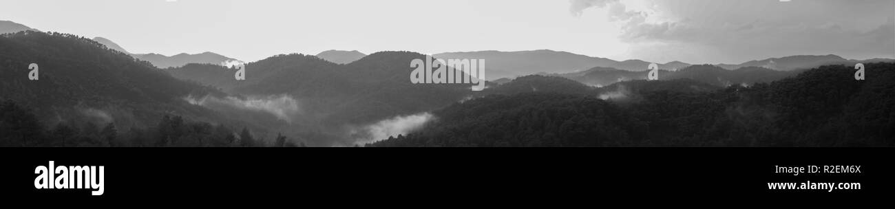 Mountain panorama. landscape with the dramatic sky view. black and white background Stock Photo