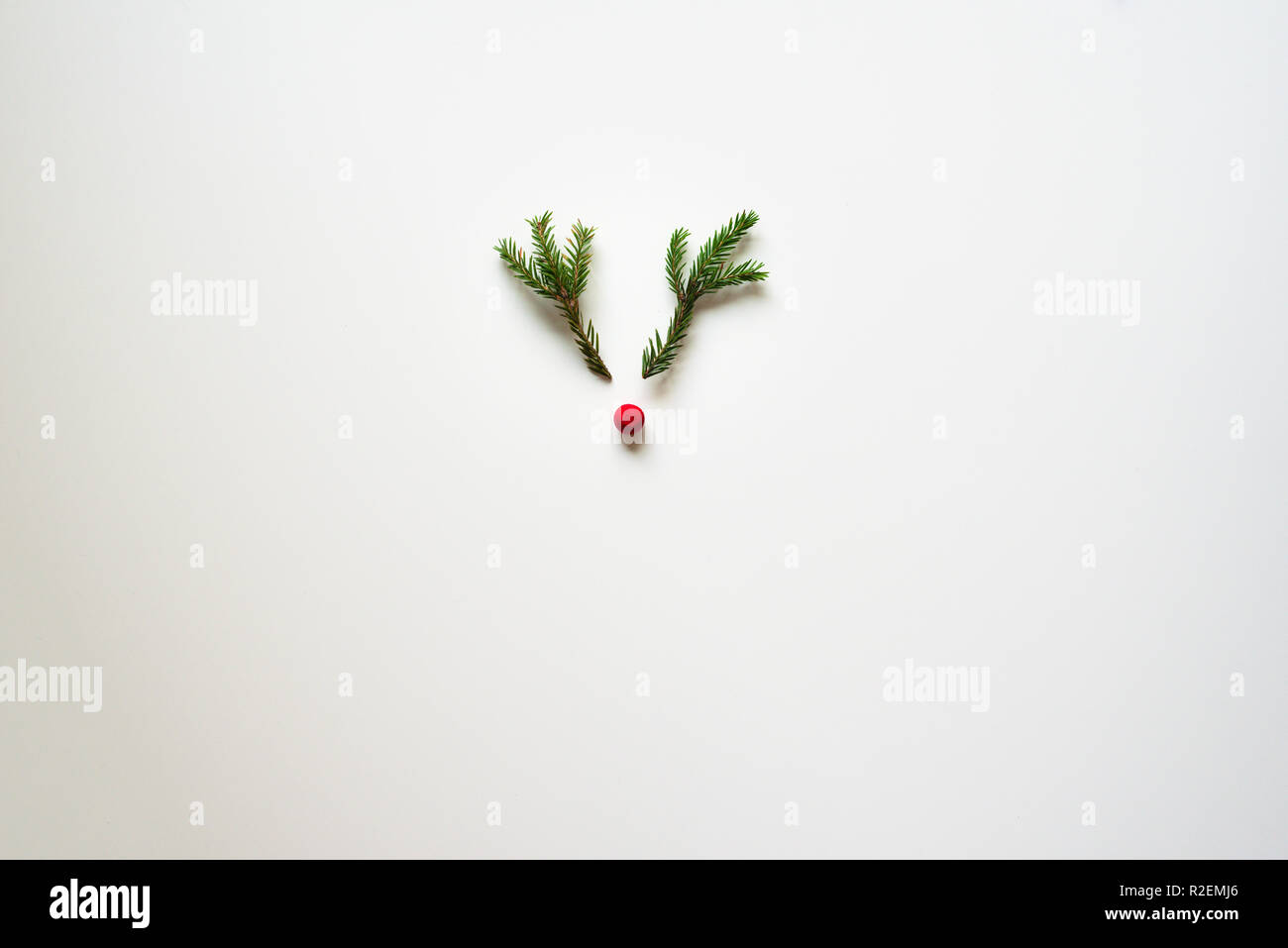 Christmas deer from tree branches and berry on whiteboard Stock Photo