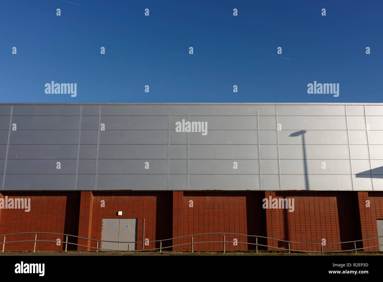 Sunlight reflecting off aluminium rainscreen cladding on building with ...