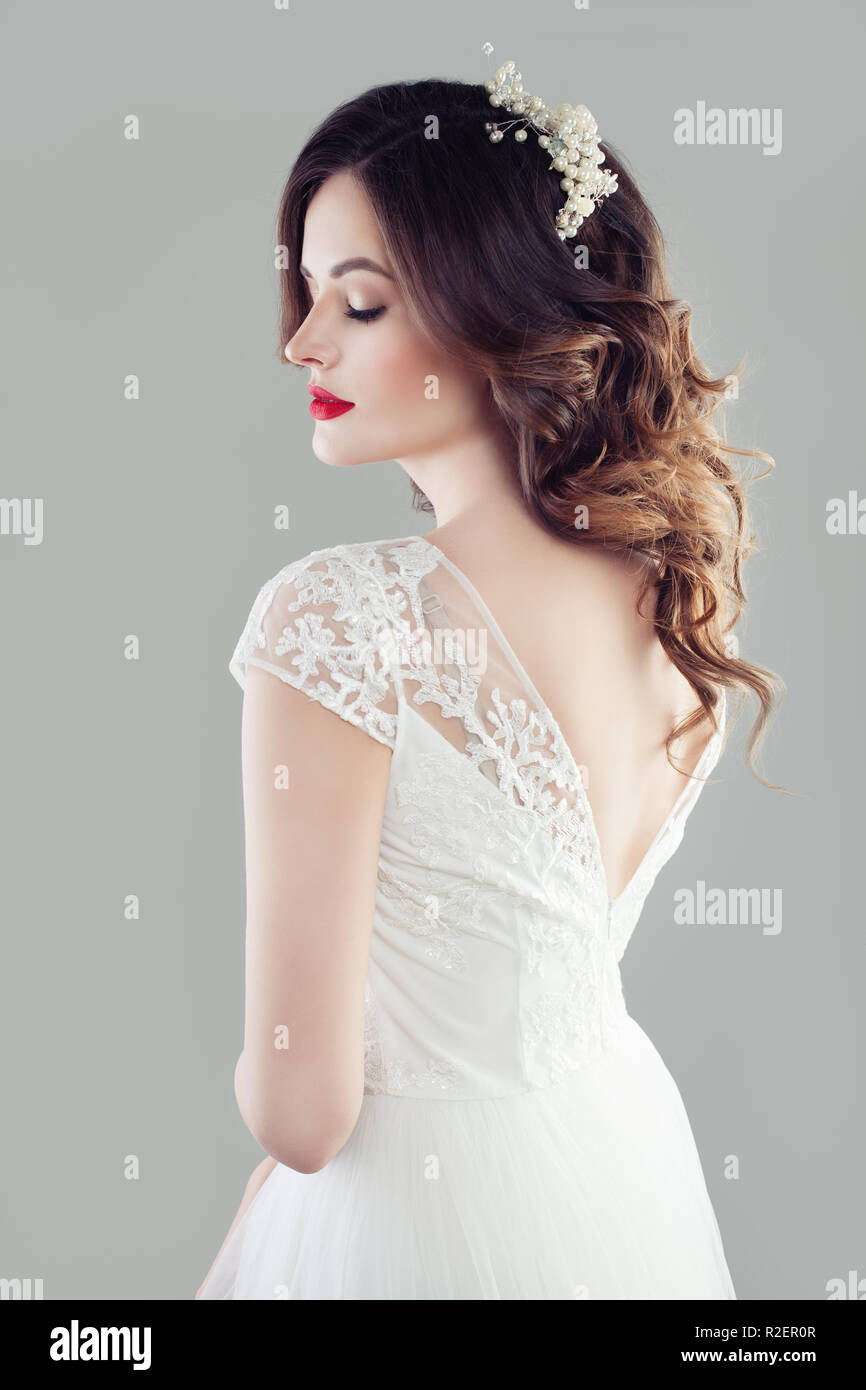 Charming young bride girl with makeup, bridal wavy hairstyle and hairdeco Stock Photo - Alamy Charming young bride girl with makeup, bridal wavy hairstyle and hairdeco Stock Photo - Alamy