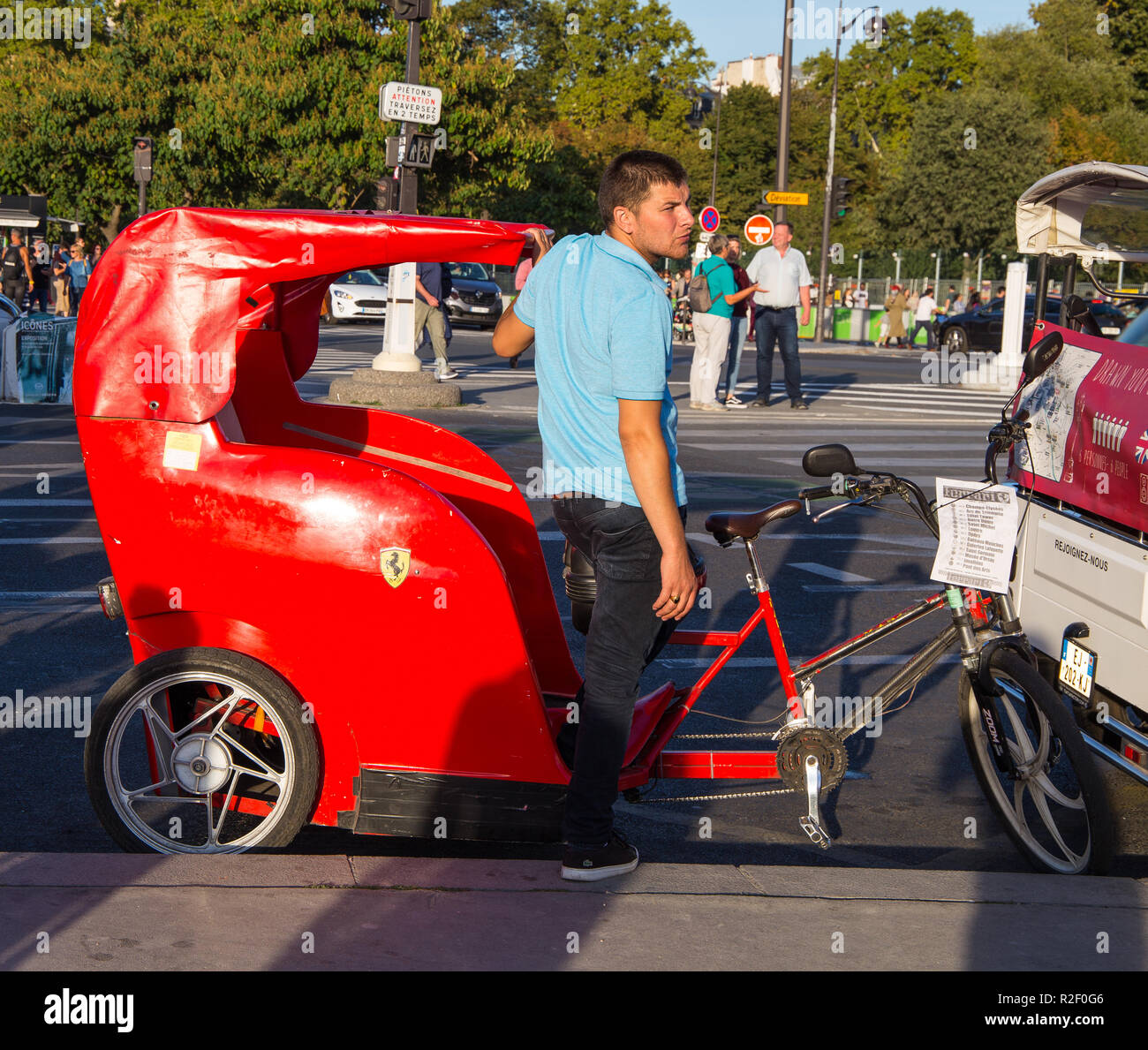 PARIS, FRANCE, SEPTEMBER 8, 2018 - Red rickshaw for tourists with ...