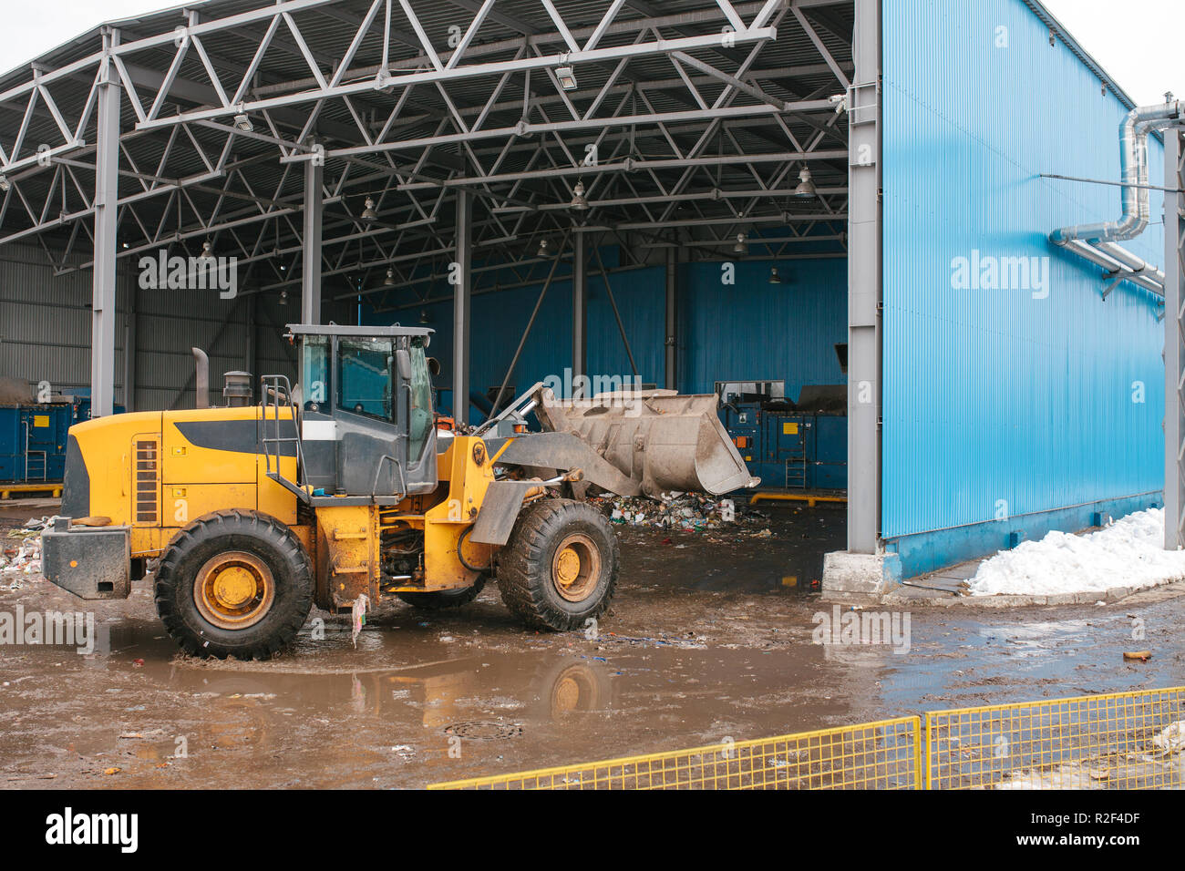 Special machinery or bulldozer work on the site of waste unloading at ...