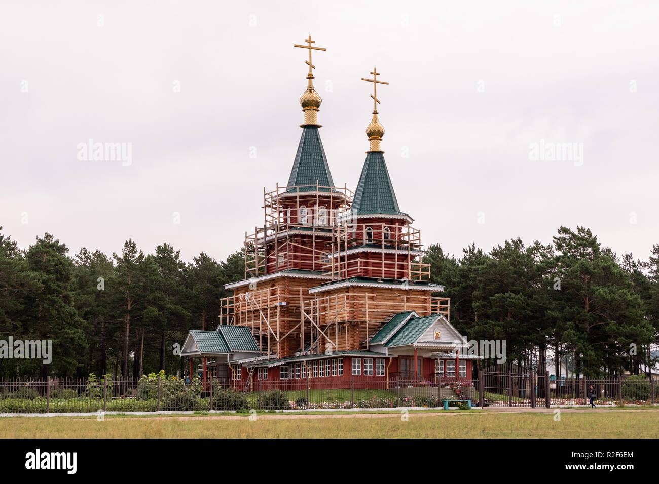 Ust-Uda, Irkutsk Region, Russia - August 18, 2018: Facade in scaffolding temple of the Epiphany. Stock Photo