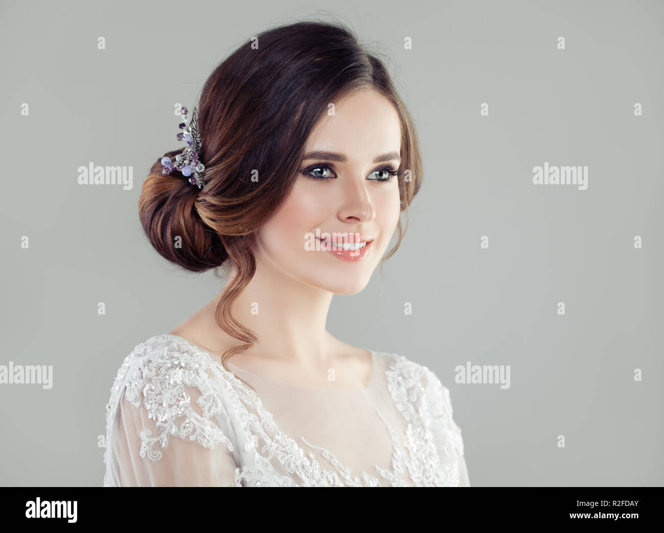Cheerful woman with bridal updo hair, portrait Stock Photo