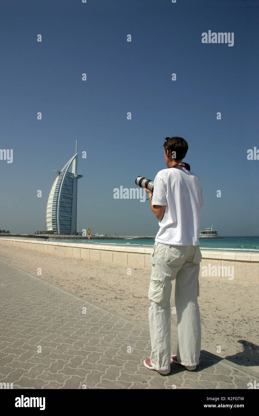 photographer in front of burj al arab Stock Photo