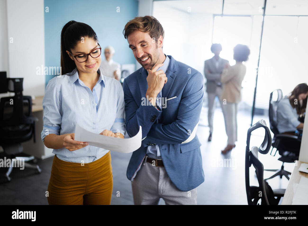 Successful group of business people at work in office Stock Photo - Alamy