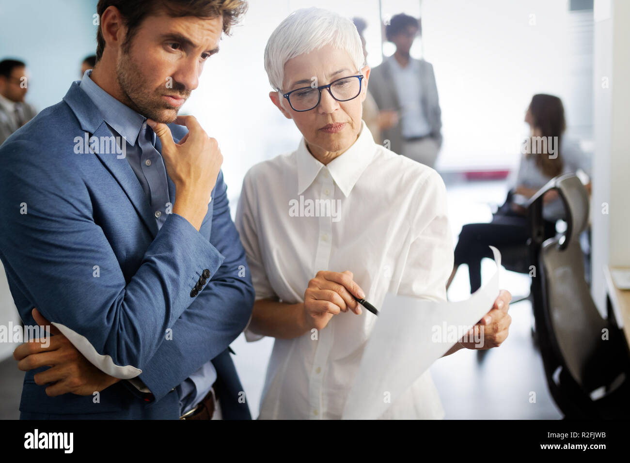 Successful group of business people at work in office Stock Photo