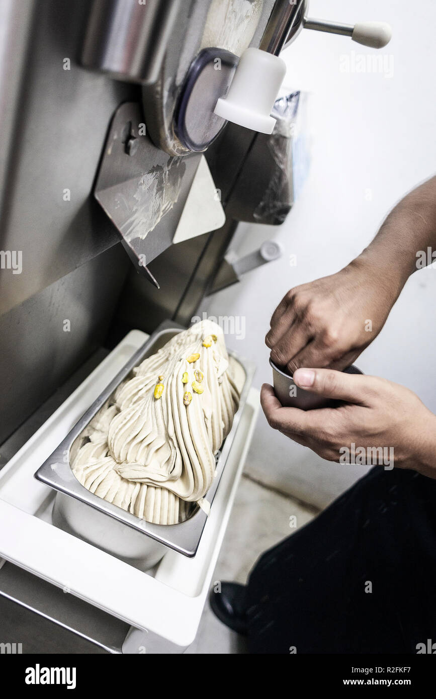 making gelato ice cream with modern professional equipment preparation
