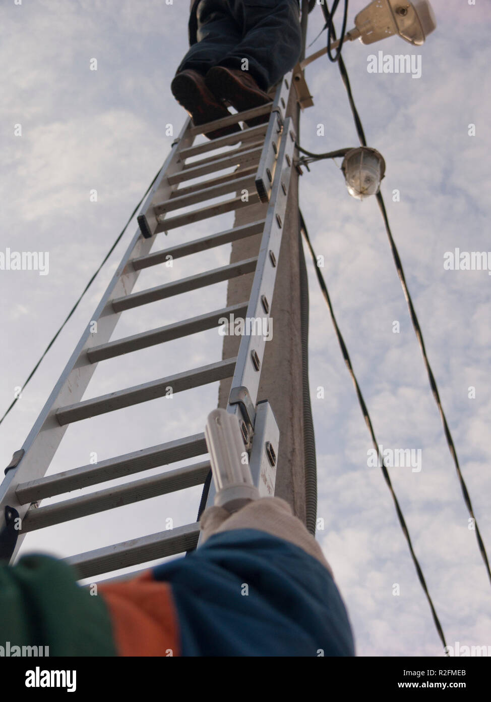 Electricians replacing lamps Stock Photo