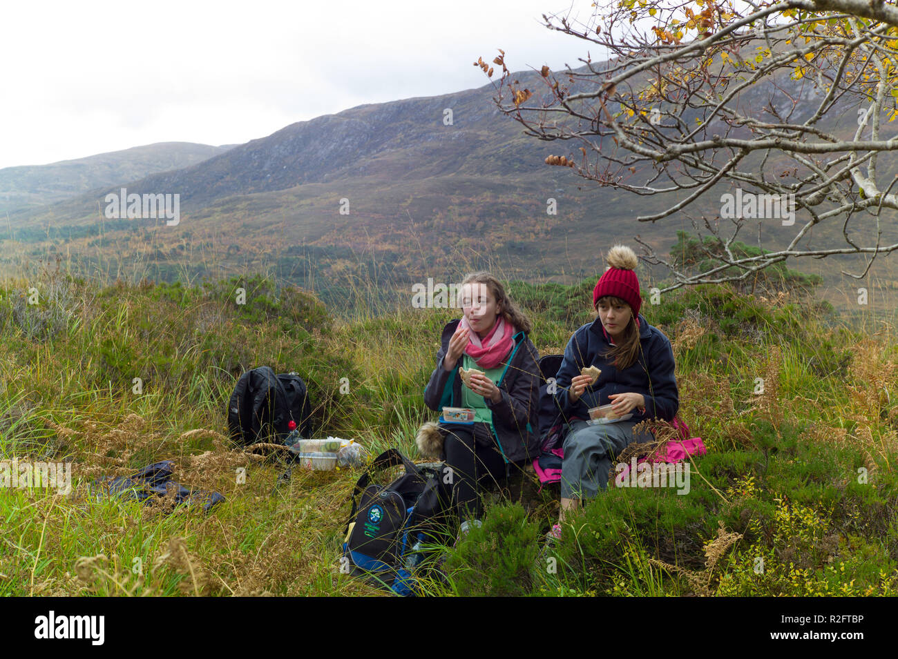 Walkers on the north side footpath beside  Loch Affric Glen Affric, Highlands, Scotland. Stock Photo