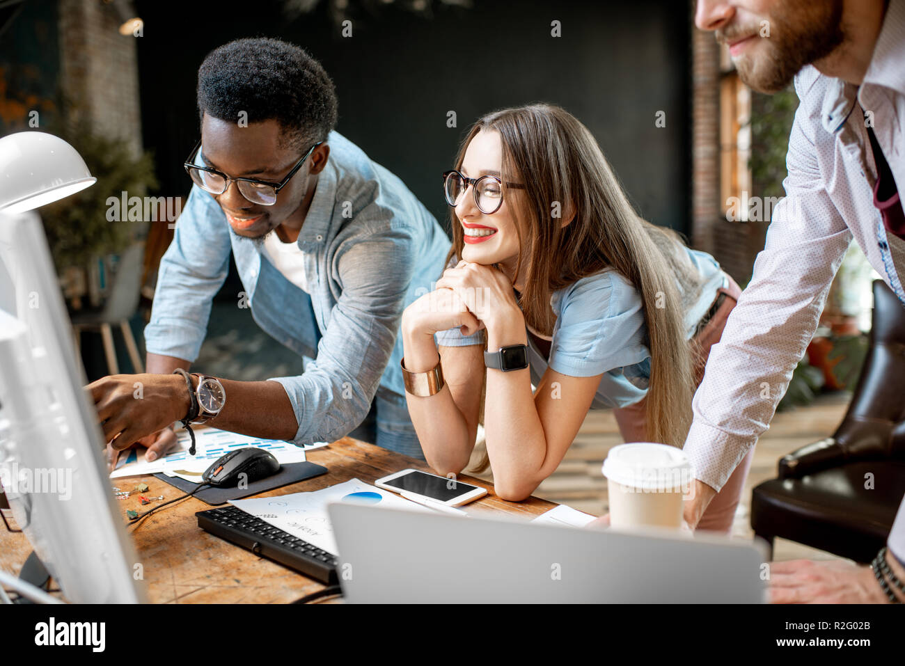 Group of young multi ethnicity coworkers dressed casually working