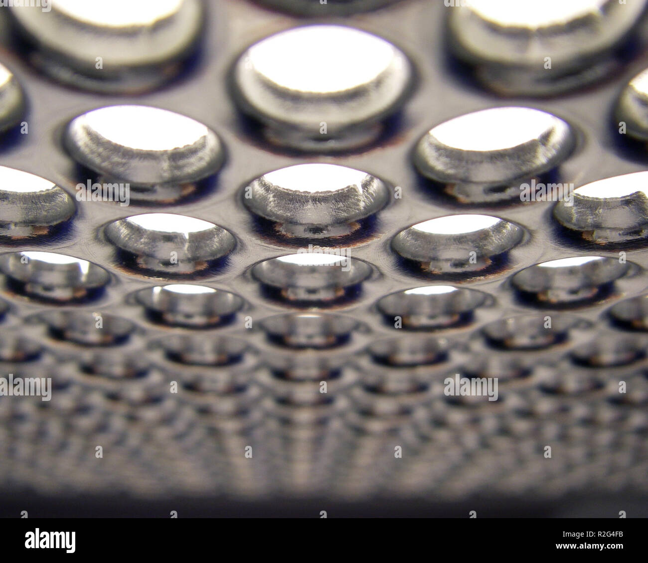 macro of a perforated metal lamp Stock Photo Alamy