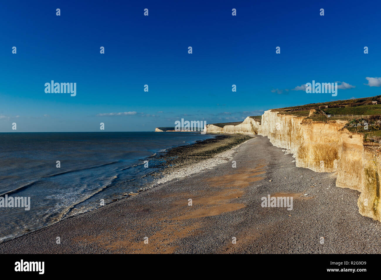 View of the cliffs of Birling Gap on Seven Sisters National Park in The United Kingdom on a sunny day with clean blue sky Stock Photo