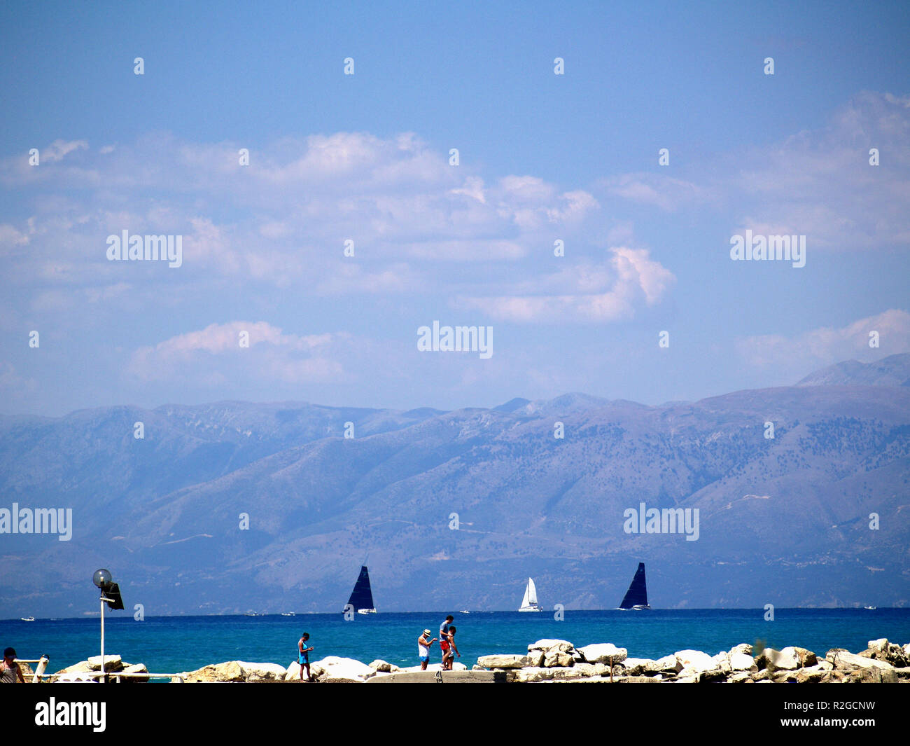 Yacht regatta of the coast of Roda, Corfu, Greece, with distinctive black sales Stock Photo