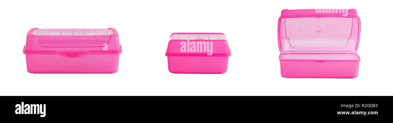 Pink lunch boxes on a white background, in different settings. Stock Photo