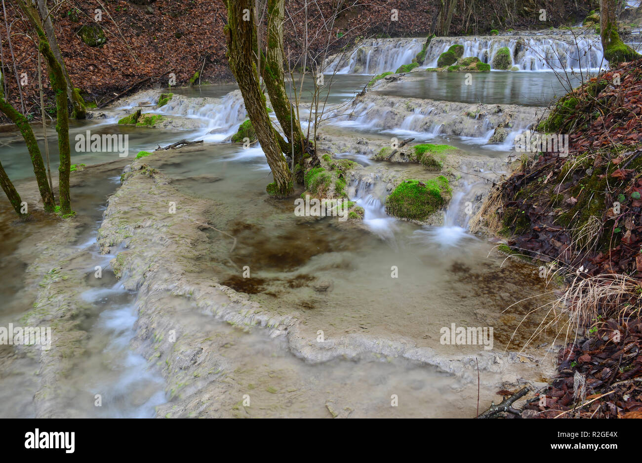 Several small bigar ponds in the form of cascade formed by limestone sedimentation, waterfalls, clear turquoise water of Bigar creek, Kalna, Serbia, c Stock Photo