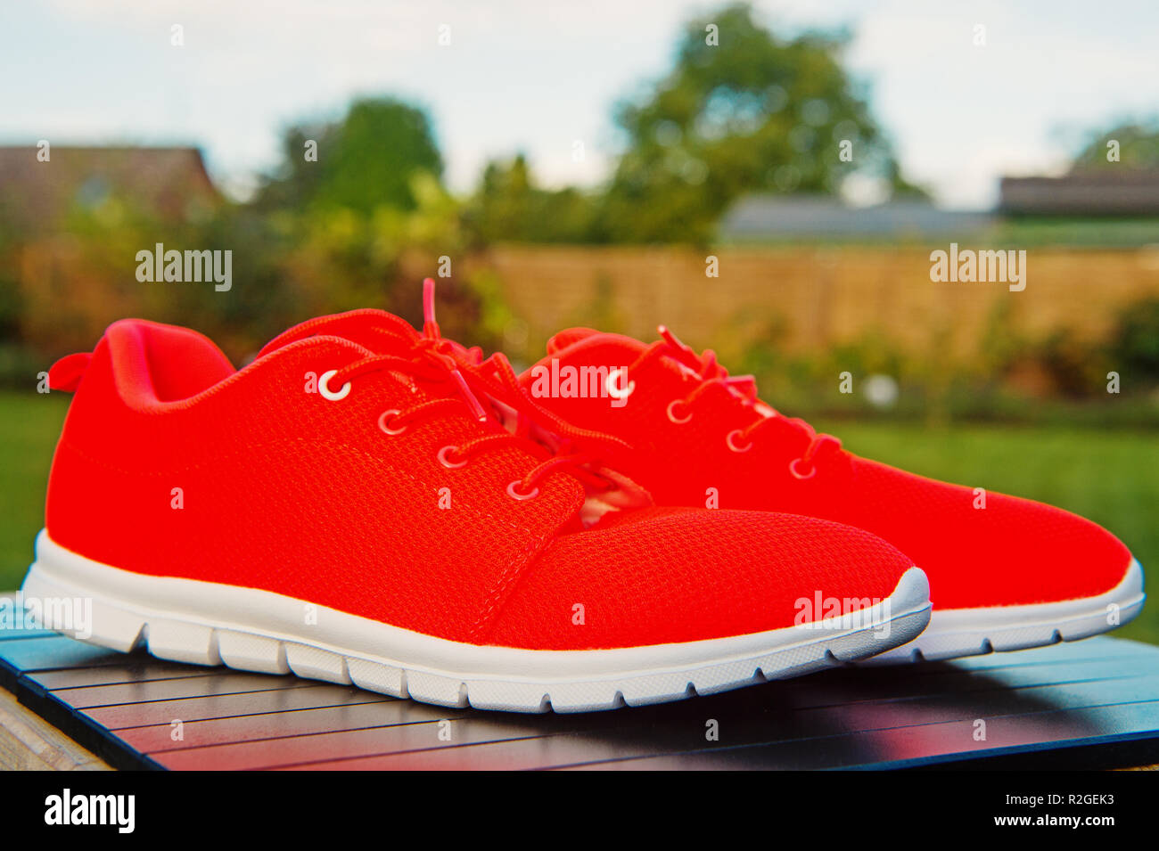 Sports shoes sneakers bright orange color. Sports in the open air. orange  sport sneakers modern style. fitness and health Stock Photo - Alamy