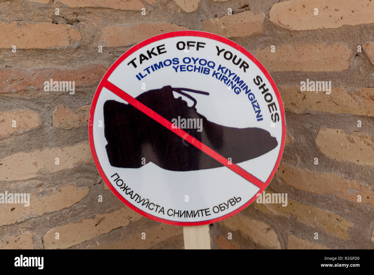 Take Your Shoes Off sign, Shahrisabz, Uzbekistan Stock Photo
