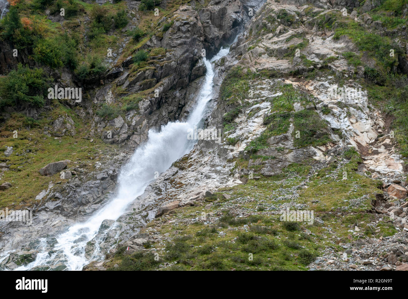 Close up of gushing water in a glacial waterfall. photographed at Sulzenaualm, Stubai, Tyrol, Austria Stock Photo
