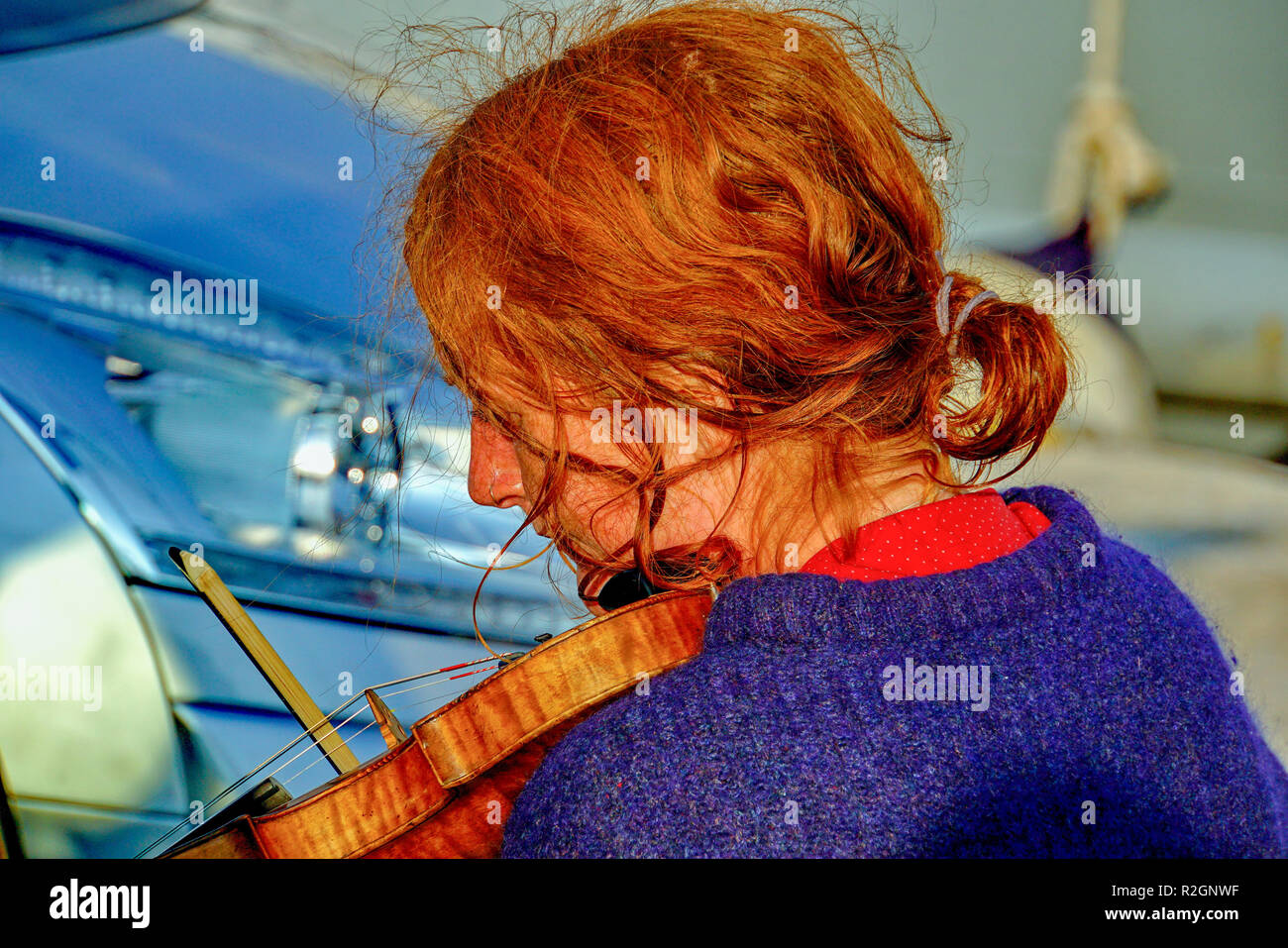 Portrait of ginger haired female violinist Stock Photo