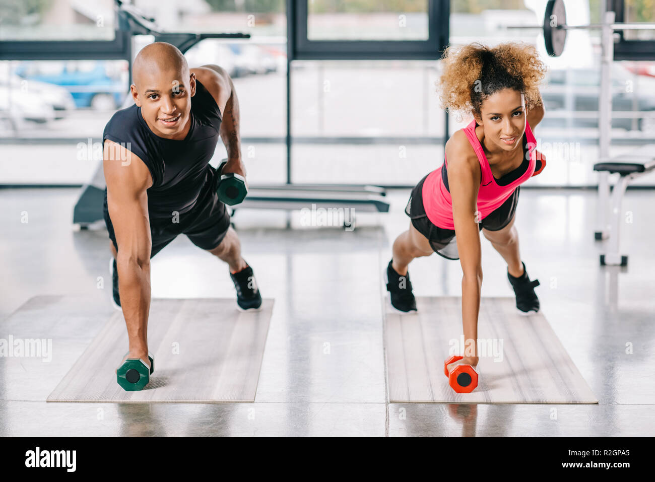 Cheerful African American Couple Of Athletes Exercising With