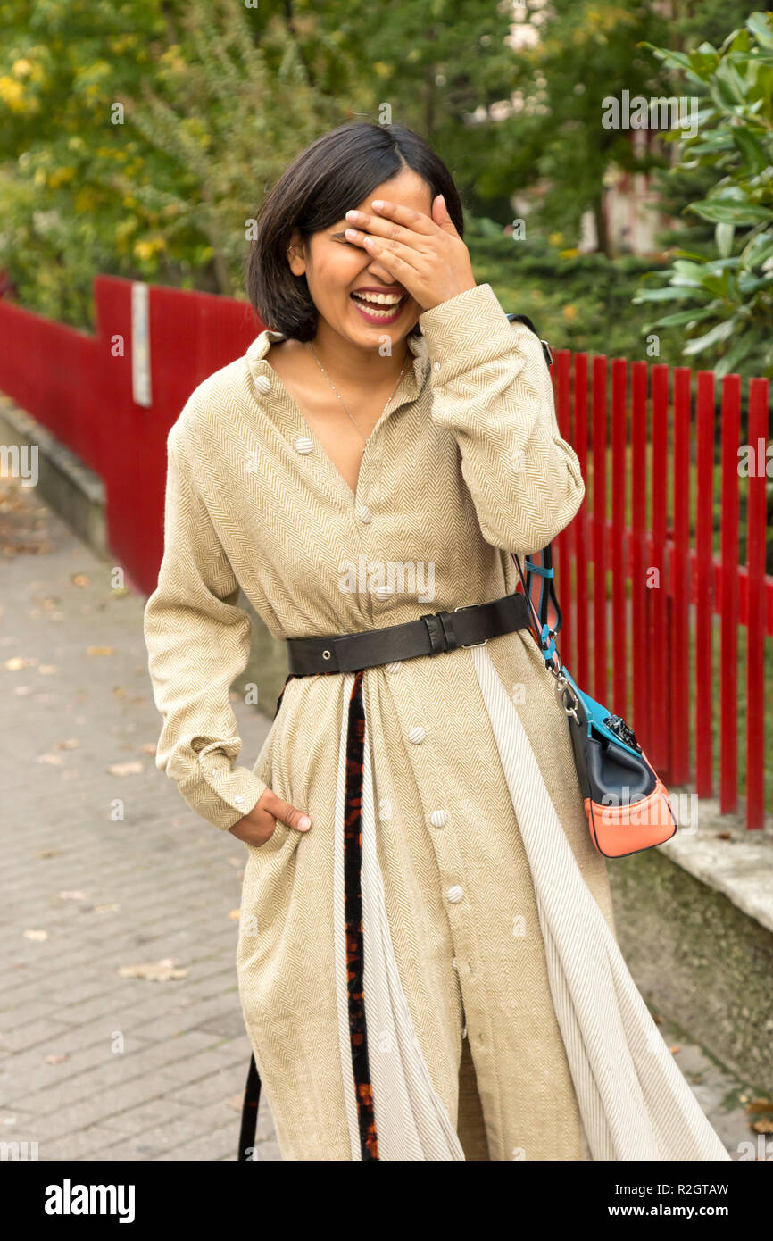Beautiful young Indian woman posing in an urban context. Street fashion ...