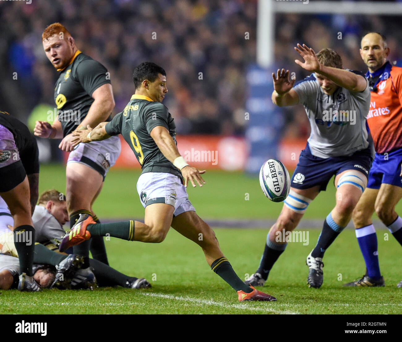 Embrose Papier  of South Africa kicks with Jonny Gray of Scotland attempting to charge down during the Autumn International match at BT Murrayfield, Edinburgh. Stock Photo