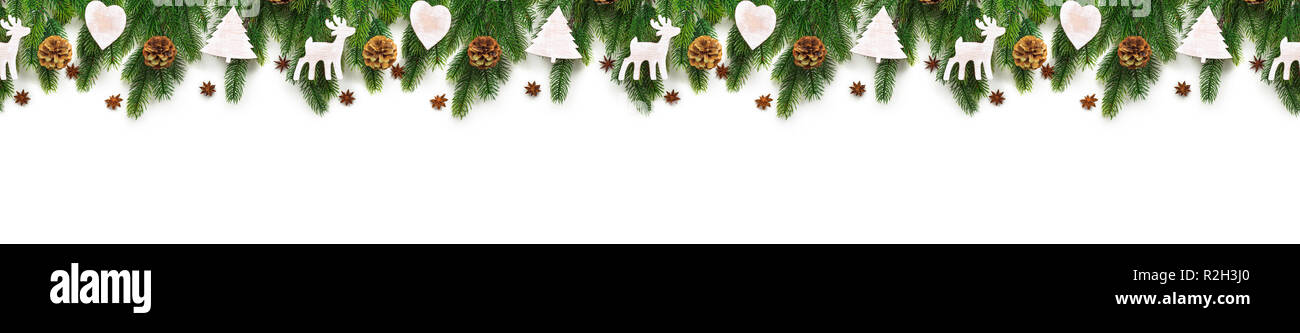 Christmas tree branches on white background as a border Stock Photo - Alamy