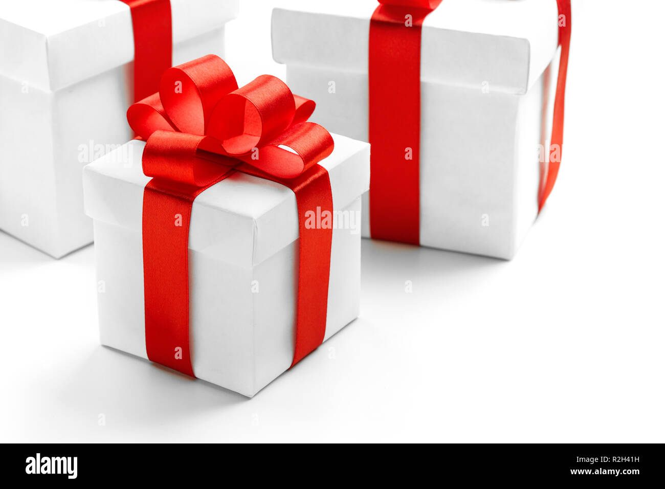 Gift boxes with red ribbon bow isolated on white background Stock Photo ...