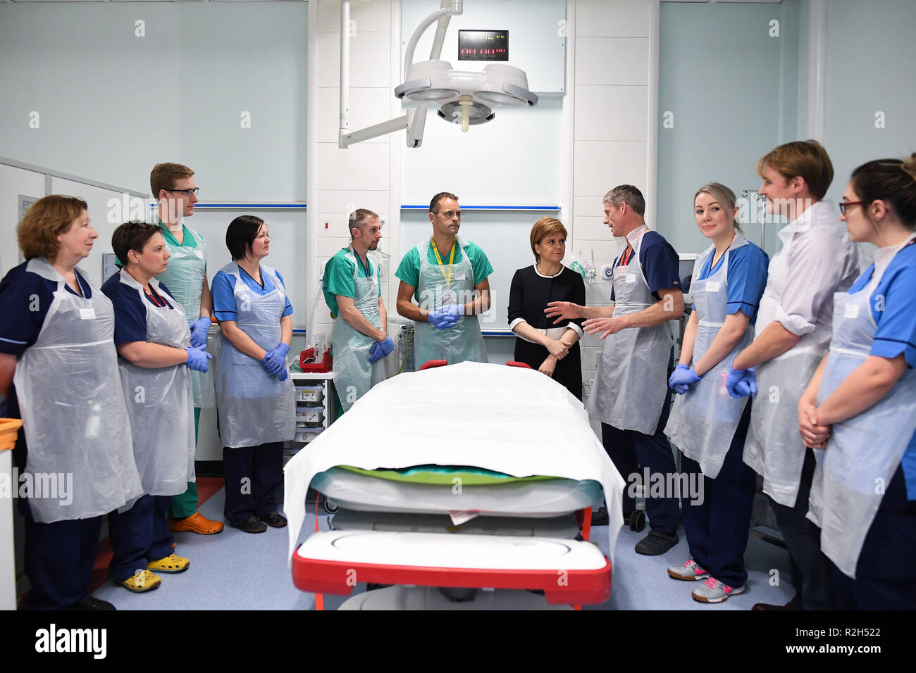 First Minister Nicola Sturgeon talks with Dr Michael Donald (fourth right) in the Resuscitation